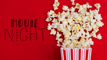 Movie Night in black writing against red background with bag of popcorn 