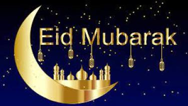 Eid Mubarak golden sliver of moon in night sky