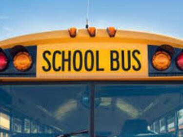 front of school bus, top half, blue sky