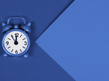 Blue clock on blue background