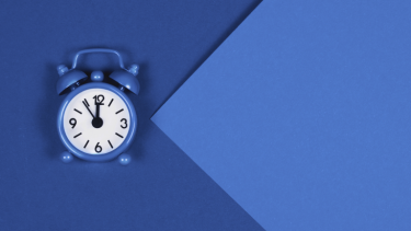 Blue clock on blue background