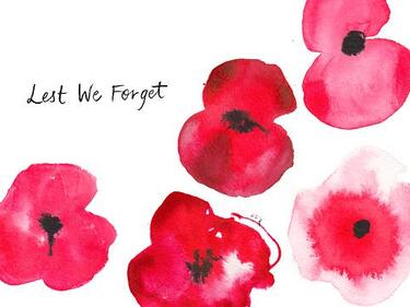 Lest We Forget written on a white background small letters beside water colour poppies
