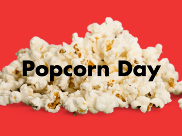 Popcorn Day written in black on top of a pile of popcorn with a red background