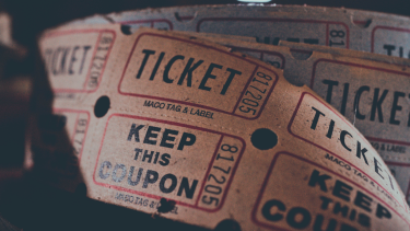 A bunch of brown raffle tickets