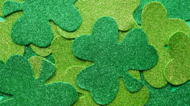 Glitter Shamrocks piled on top of each other, light and dark green