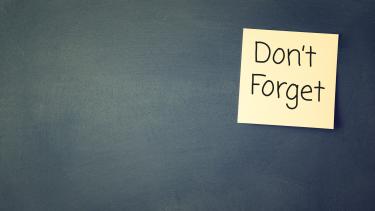 Don't Forget Chalk board with yellow sticky note "Don't Forget"