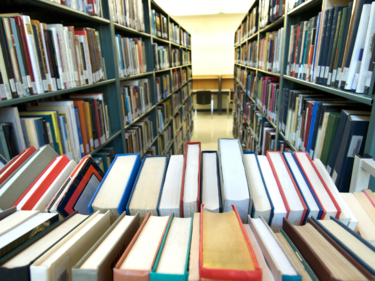 Library with view of a shelves with books on it