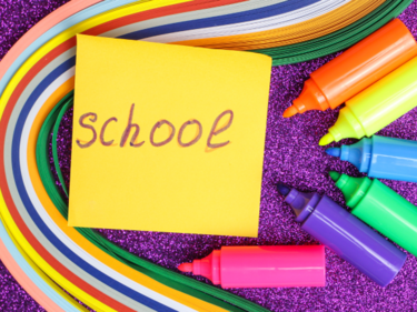 School on Sticky Note with rainbow & markers