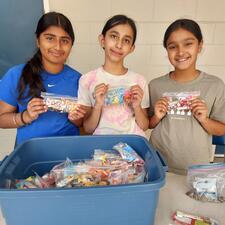 Grade 5 Volunteers selling candybags for school fundraiser