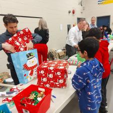 Elementary Christmas market wrapping station in school gym