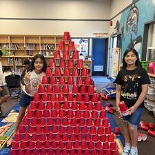 Students Building a Cup Tower