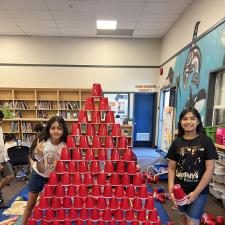 Students Building a Cup Tower