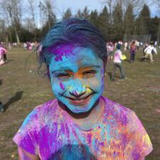 Elementary Student covered in Holi power on school field