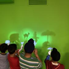 Elementary students learning shadow play in learning commons classroom