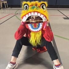 Student Dressed as Dragon for Lunar New Year Assembly