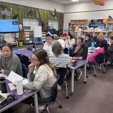 Teachers working together learning in the library